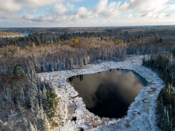 Aerial shot of snowy lake in Itasca County, Minnesota