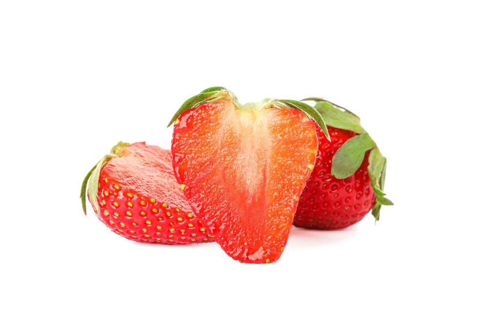 Strawberries isolated on light background. Summer sweet fruits and berries