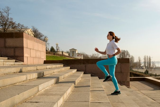 Young woman jogging on city streets