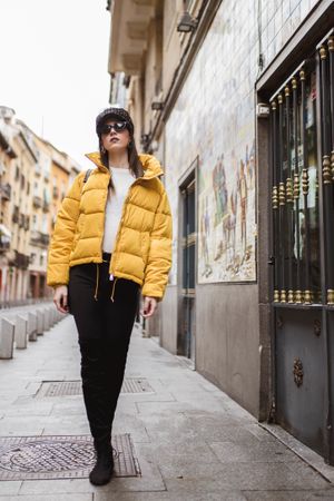 Trendy woman walking on street
