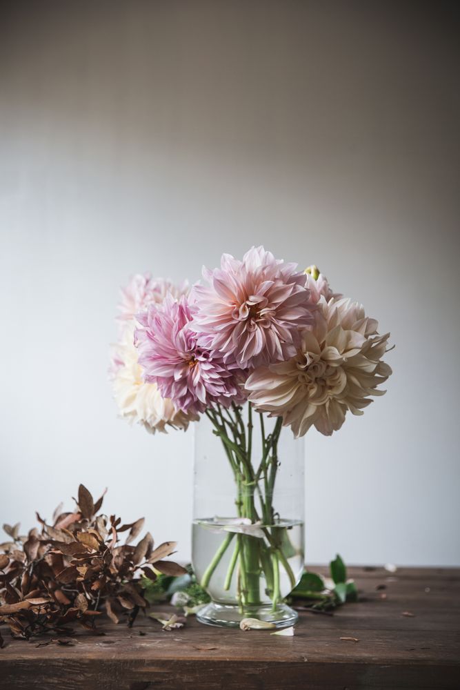 Bunch of flowers in vase on table