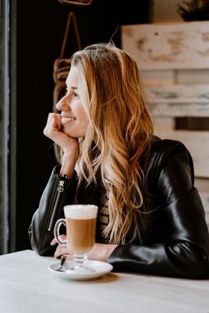 Woman drinking coffee from a glass