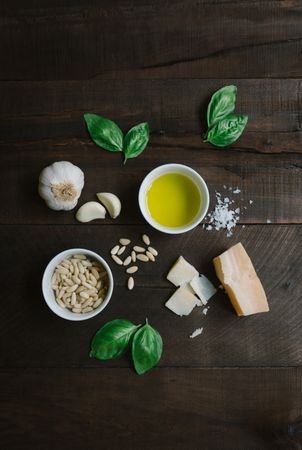 Ingredients for pesto pasta arranged at table