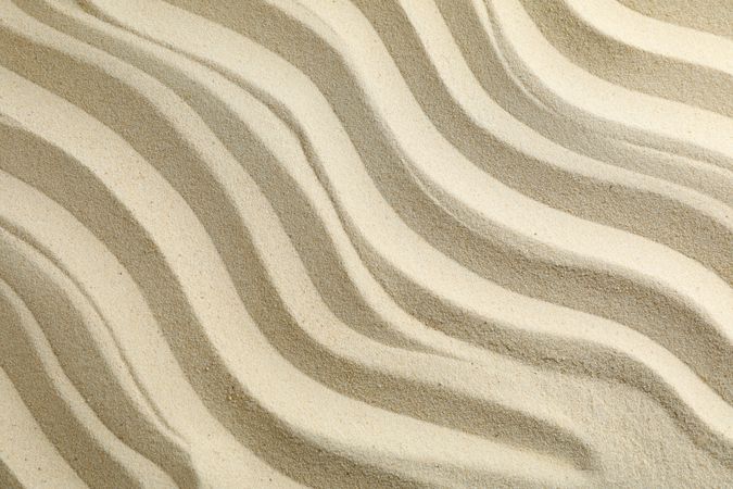 Seamless sand on a whole background, space for text. Summer vacation backdrop