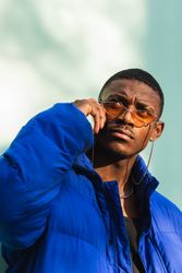 Stylish Black man in sunglasses on street
