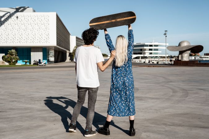 Couple standing near modern building