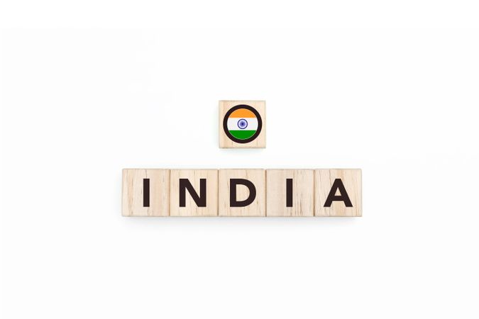 Wooden blocks bearing the name and flag of India.