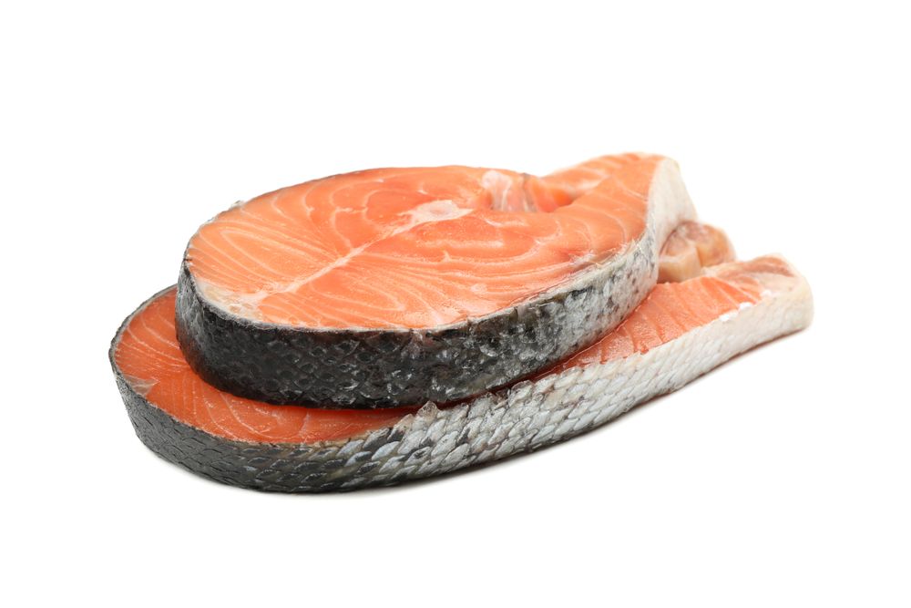 Fresh raw salmon meat isolated on light background