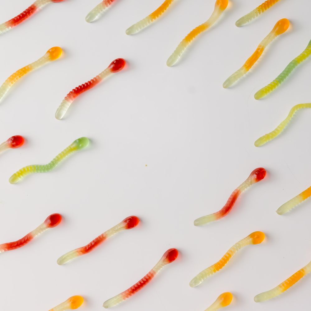 Colorful pattern made of gummy candies on bright background