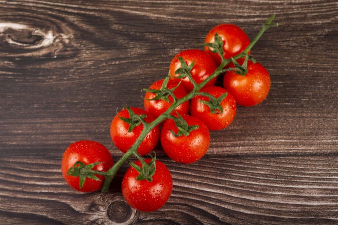 Ripe tomatoes on the wooden table.