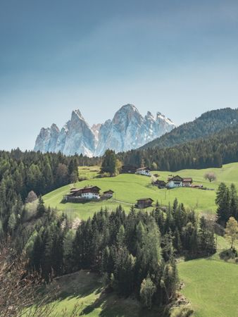 Small beautiful village between mountains with snow