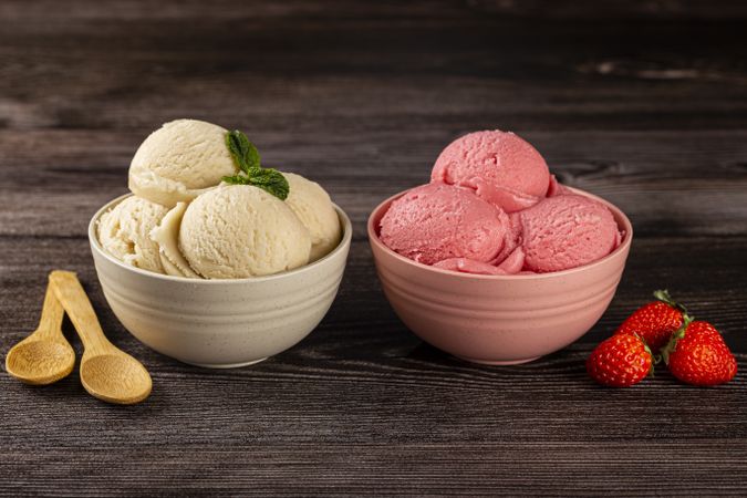 Bowls with strawberry and vanilla ice cream.