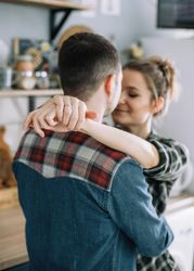 Man and woman about to kiss indoor