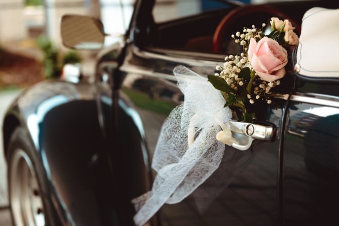 Flower on handle of retro car