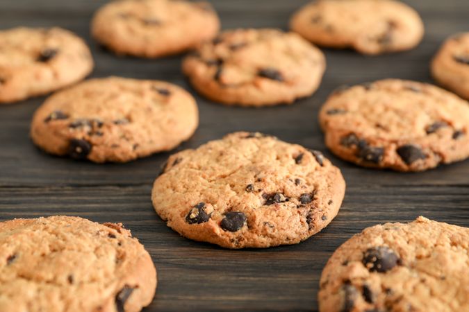 Chocolate chip cookies on wooden background