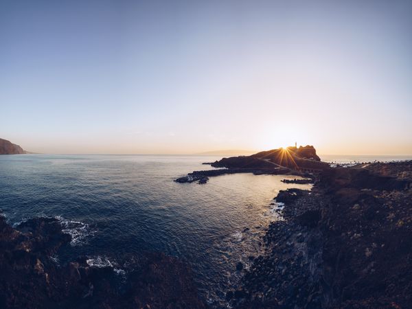 Remote rocky seaside at bright sunset