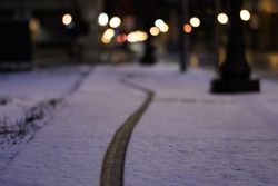 A bike tire track in the snow