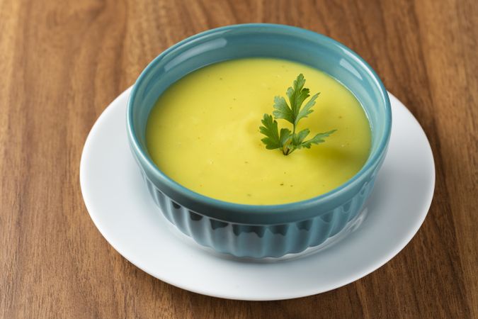 Bowl with onion soup and croutons on the table.
