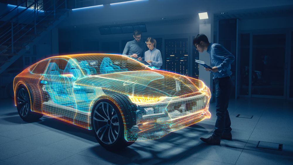 Group of Automobile Design Engineers Working in Virtual Reality 3D Model Prototype of Electric Car Chassis.