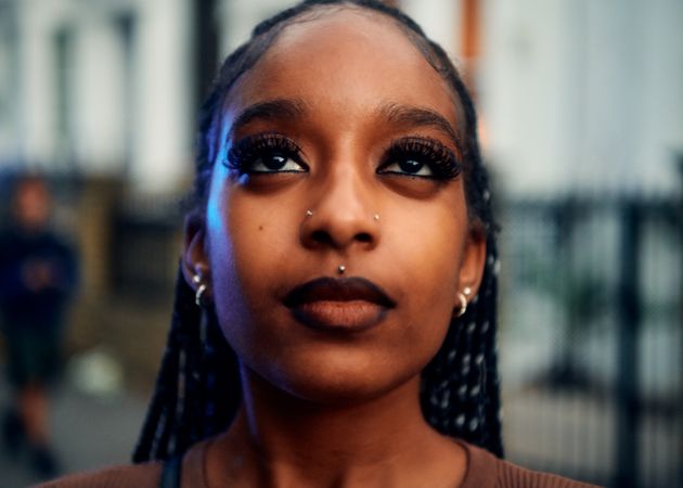 London, England, United Kingdom - August 28, 2022: Portrait of Black woman looking up