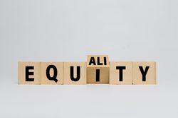 flip wooden blocks with equality and equity words isolated on plain background