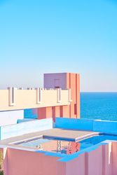 Compact pool on roof of building of geometric shapes