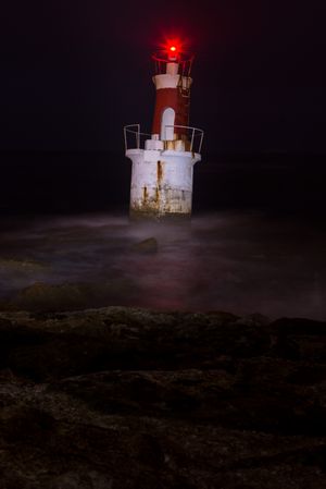 Lighthouse on rocky coastline