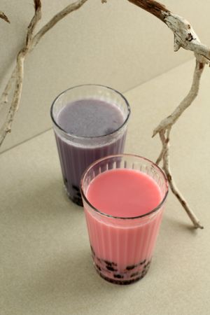 Pink and Purple Boba Bubble Milk Tea on Tall Glass
