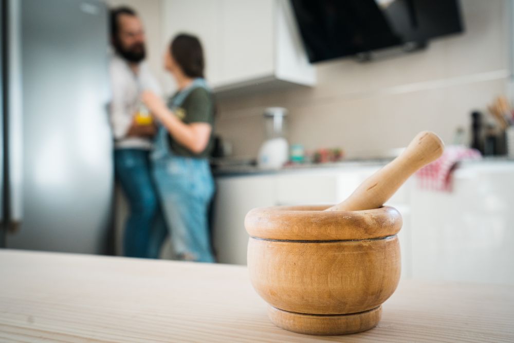 Mortar and pestle on table in kitchen