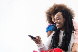 Cheerful Black dad and daughter enjoying free time together