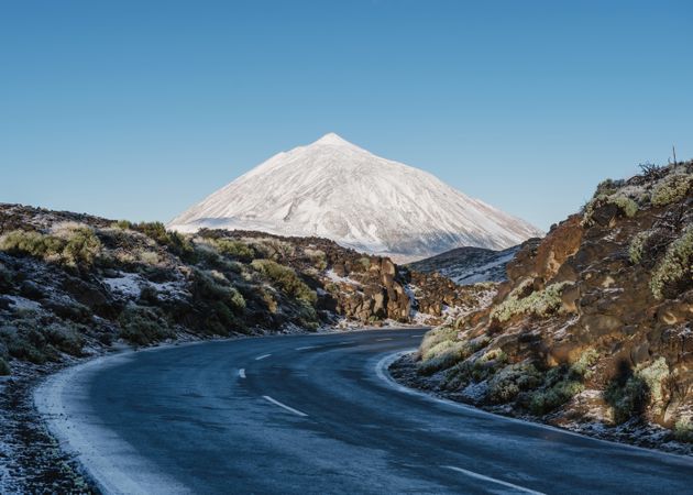 Countryside road near snowy mountain peak