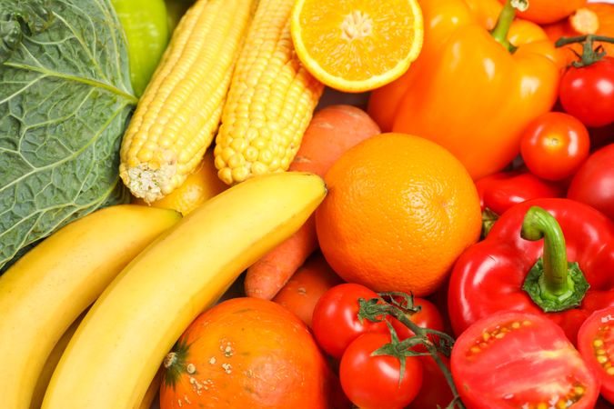 Ripe vegetables and fruits on whole background, close up