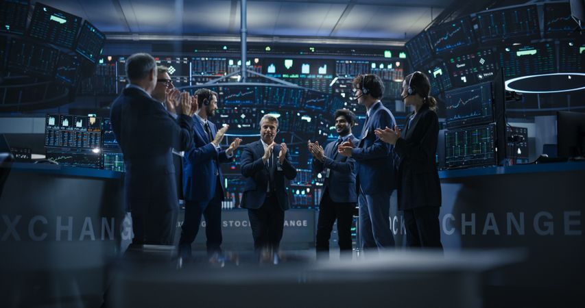 Diverse Specialists and Asset Managers Clapping, Cheering, Shaking Hands with the Team Leader