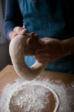 Crop man preparing Rosca de Reyes