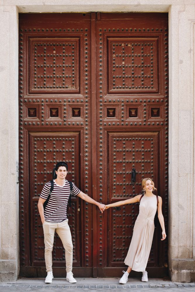 Happy couple having fun while walking in town