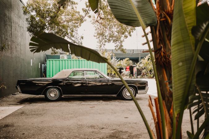 MIAMI, USA - November 13, 2018: Retro car on shabby parking lot