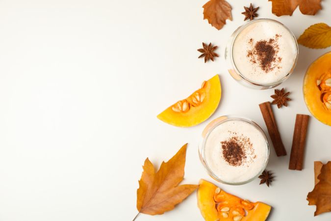 Composition with pumpkin latte on neutral background, top view