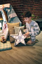 Male teen helping preparing a slumber party