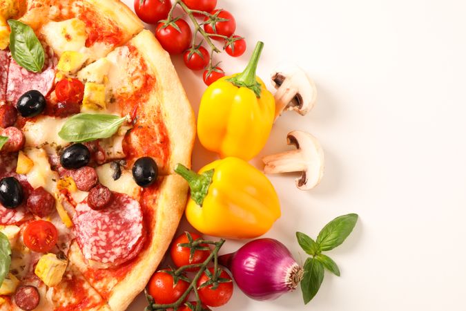 Tasty pizza and ingredients isolated on blank background, close up