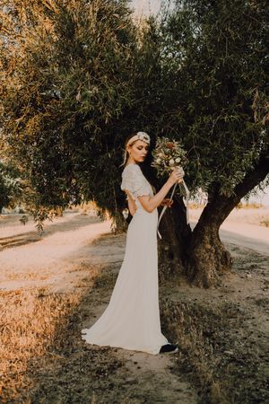 Woman in dress with flower bouquet