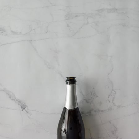 Champagne bottle on marble background