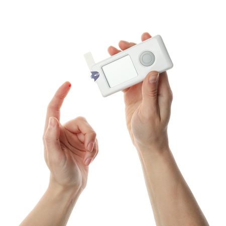 Female checking blood sugar level, isolated on blank background