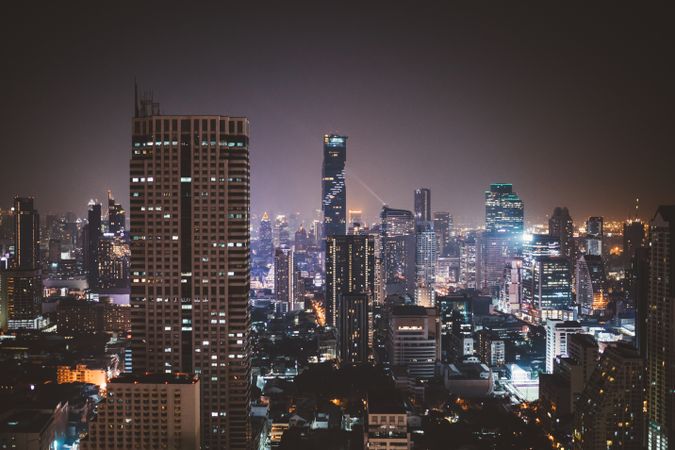 Glowing highrise buildings of metropolis