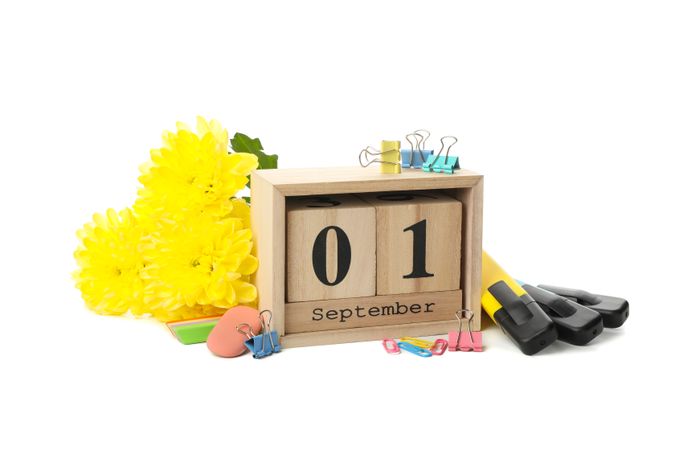 1 september wooden calendar and school supplies isolated on blank background