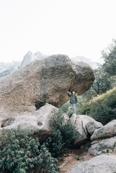 Boy walking on rocky hill