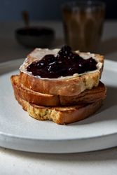 Toasted brioche butter and jam close up