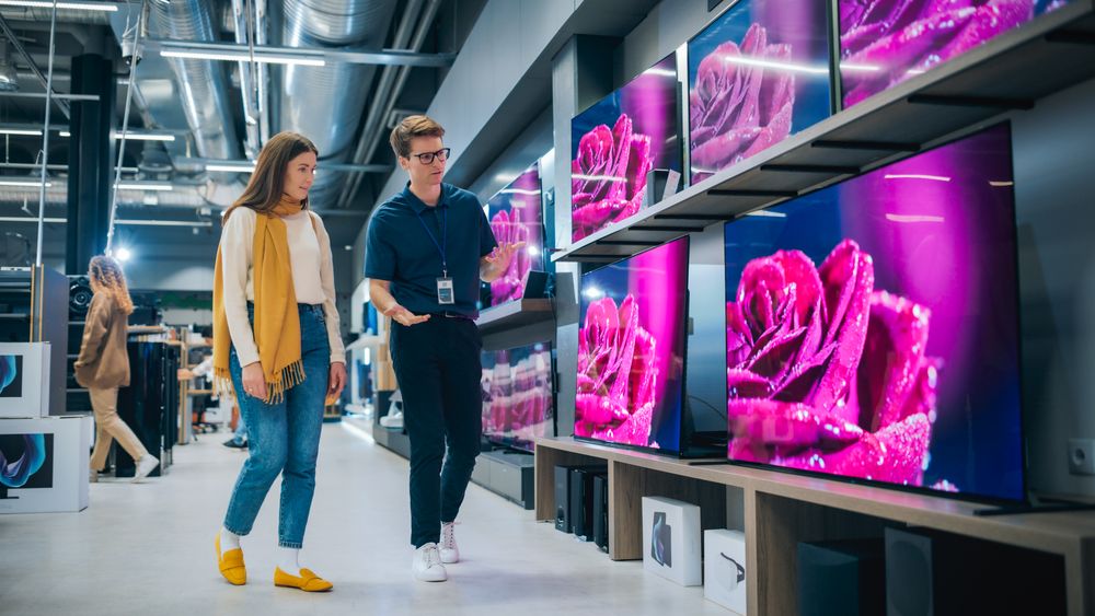 Customer Seeking Impressive Television Solutions in Retail Store.