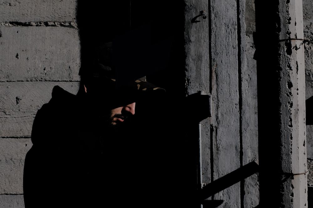 Modern man inside desolate building