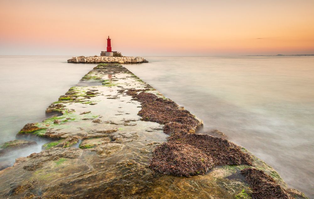 Rough path to islet with lighthouse