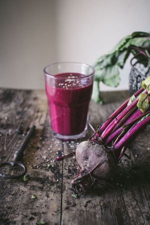 Beetroot and fresh smoothie on wooden table